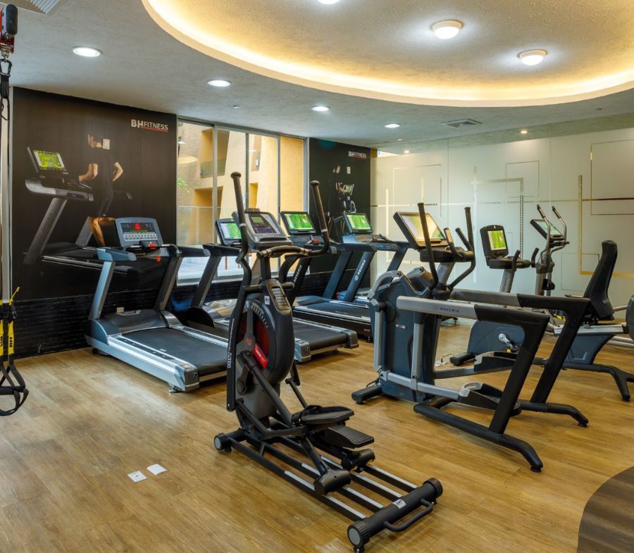 a room with treadmills and exercise machines